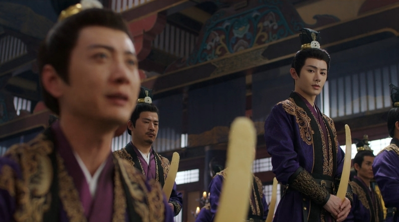 A scene from Chinese period drama, A Dream Within a Dream episode 8 recap of 2 men in Imperial court wearing purple robes and holding tablets