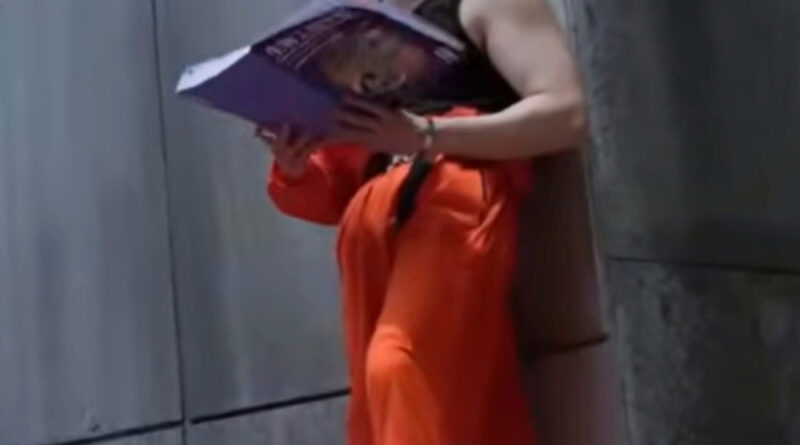 Affinity episode recap: Chinese sci-fi drama scene of a man in orange prison overalls standing on another prisoner