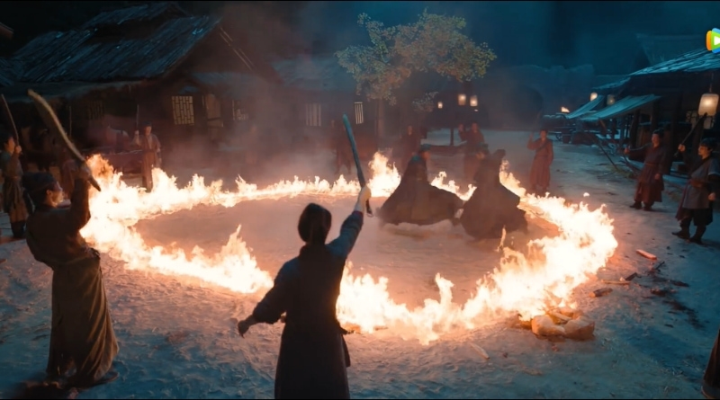 Scene from modern Chinese drama The Road To Splendor Episode 12 recap of 2 men fighting in a ring of fire