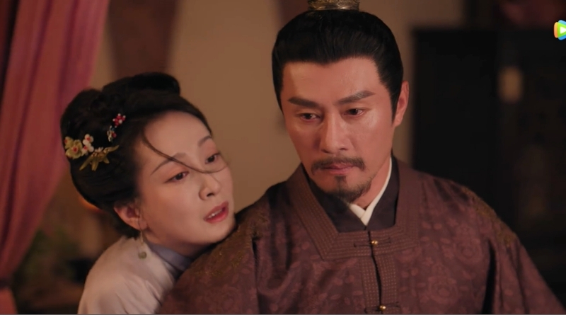 Scene from modern Chinese drama The Road To Splendor Episode 14 recap of a distressed woman hugging a man from the behind