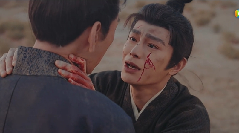 Scene from modern Chinese drama The Road To Splendor Episode 17 recap of a man crying as he's holding the neck of another man while bleeding