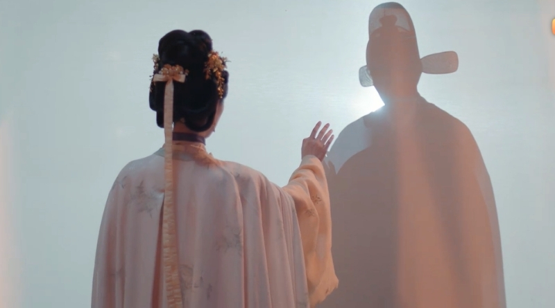 Scene from modern Chinese drama The Road To Splendor Episode 19 recap of a man and woman's silhouette through a curtain and hands reaching out