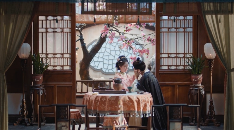 Scene from modern Chinese drama The Road To Splendor Episode 22 recap of a woman placing her hand lovingly on her husbands face