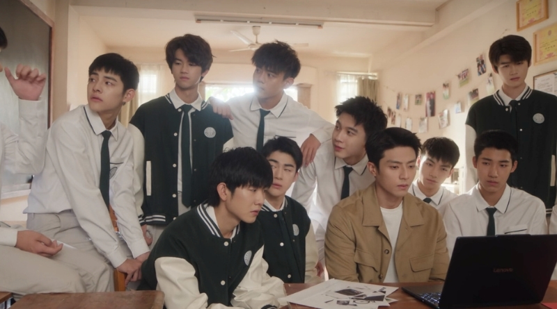 Scene from modern Chinese drama Road To Success Episodes 27-28 recap of a bunch of students with their teacher looking at a laptop in a classroom