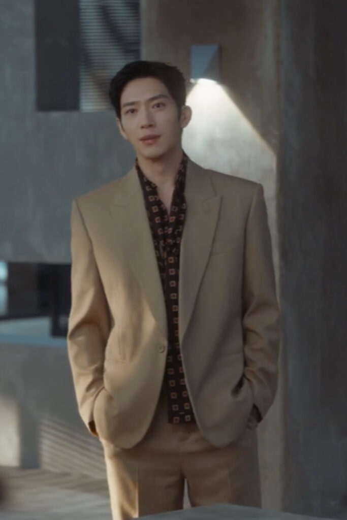 Scene from modern Chinese drama The Early Spring Episode 1 recap and review of a man in a beige suit and brown shirt