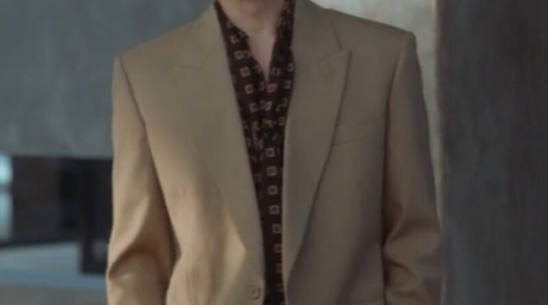Scene from modern Chinese drama The Early Spring Episode 1 recap and review of a man in a beige suit and brown shirt