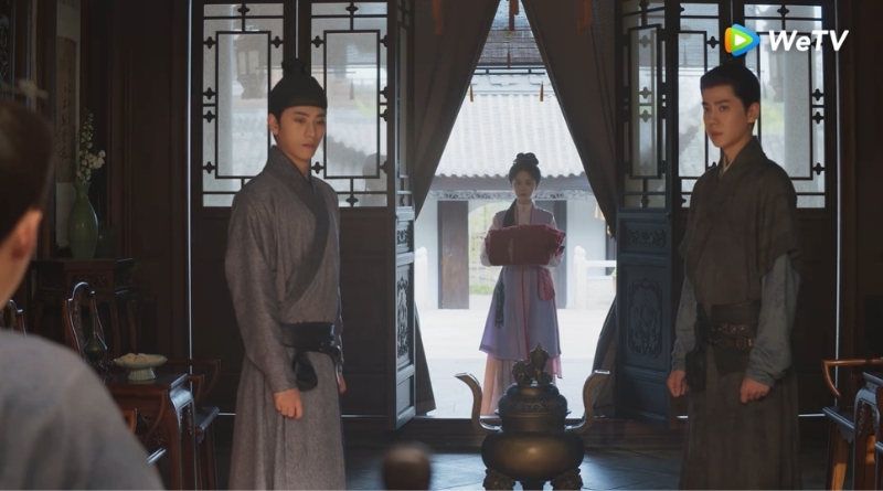 Scene from period Chinese drama Against The Current (2026) Episode 12 Recap and review of a woman walking in with a padded coat with 2 men standing to the side