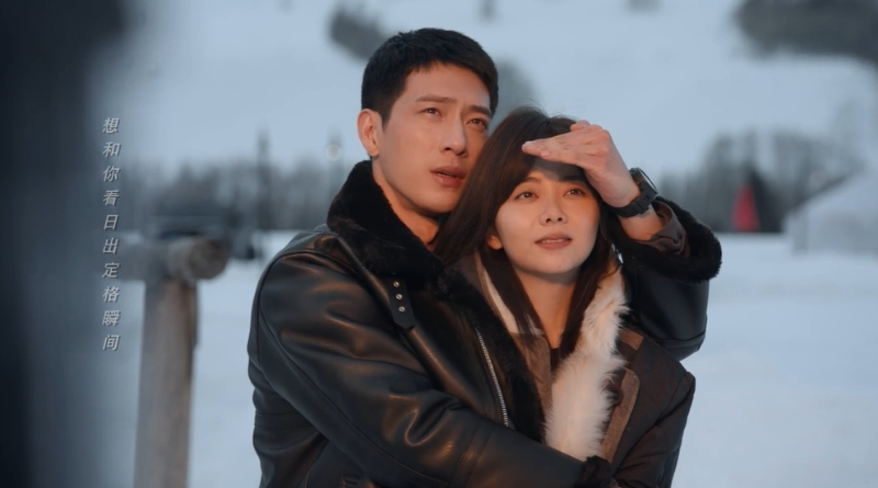 Scene from modern Chinese drama Road Home Episode 11 recap and review of a couple watching the sunrise with the man shielding her eyes from the brightness