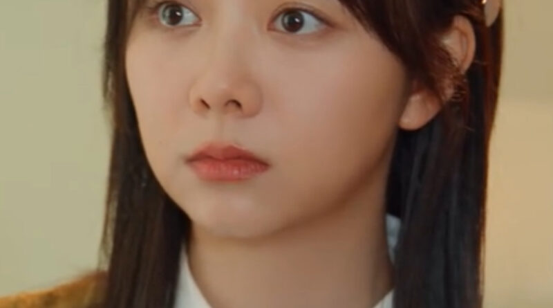 Scene from modern Chinese drama Road Home Episode 14 recap and review of a chinese woman looking concerned with brown hair and a brown vest over shirt collared shirt