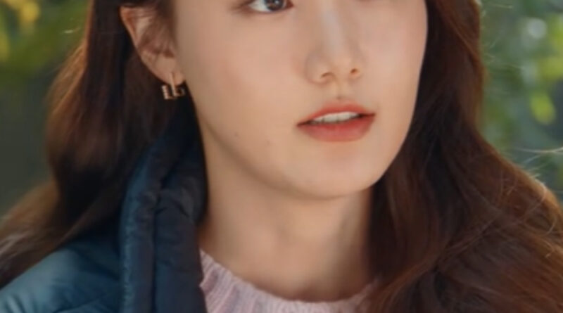 Scene from modern Chinese drama Road Home Episode 15 recap and review of a chinese woman with long brown hair in a green puffy jacket