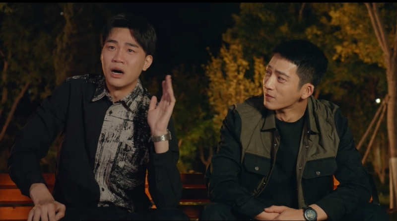 Scene from modern Chinese drama Road Home Episode 20 recap and review of a friend happy crying next to his friend in the park