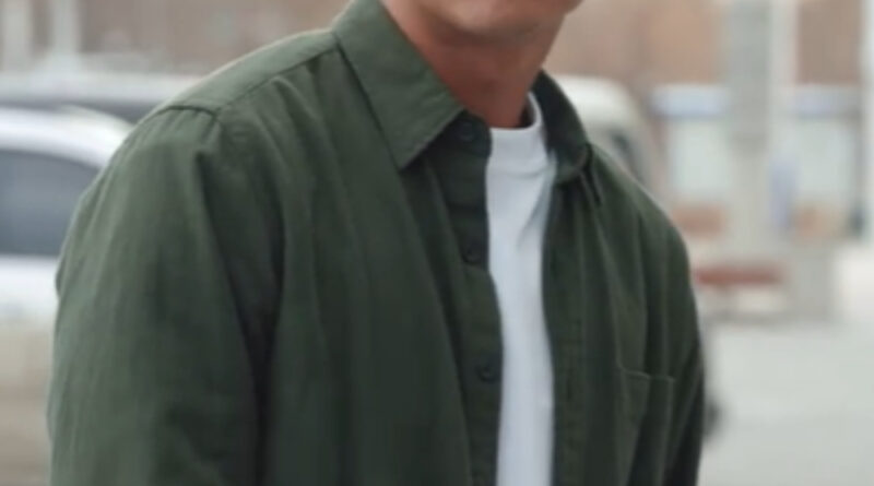 Scene from modern Chinese drama Road Home Episode 21 recap and review of a chinese man with a white tshirt and green shirt