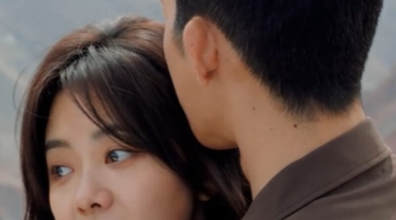 Scene from modern Chinese drama Road Home Episode 23 recap and review of a couple hugging in the mountains