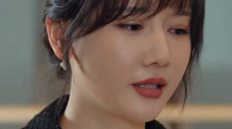 Scene from modern Chinese drama Road Home Episode 5 recap and review of a Chinese woman in a white coat with black collar