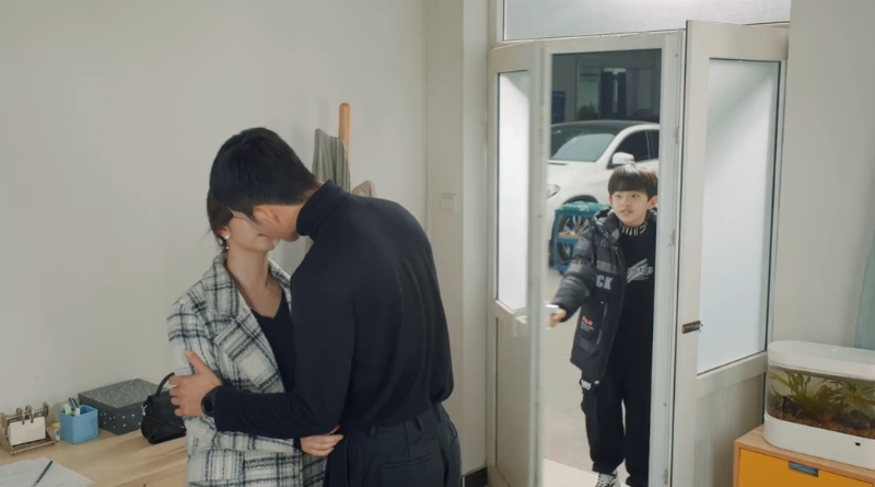 Scene from modern Chinese drama Road Home Episode 9 recap and review of a couple kissing and a boy opening the door and interrupting