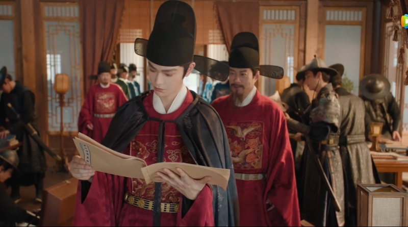 Scene from period Chinese drama The Road To Splendor Episode 28 recap and review of man reading a ledger with a lot of people behind him packing