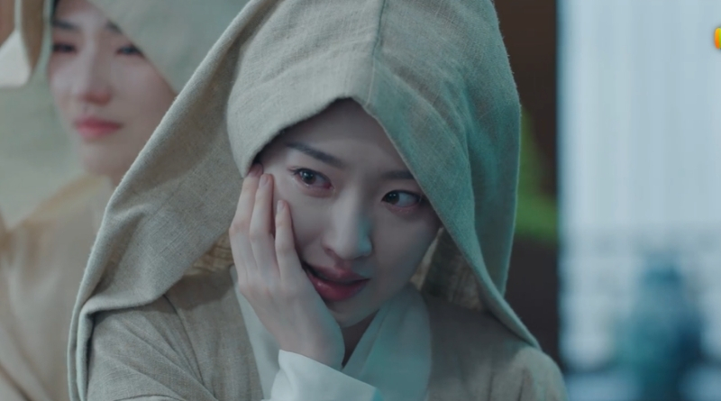 Scene from period Chinese drama The Road To Splendor Episode 29 recap and review of woman in funeral attire putting her hand on her cheek