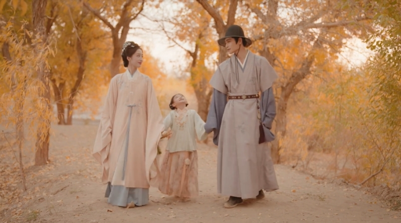 Scene from period Chinese drama The Road To Splendor Episode 36 recap and review of a happy family walking in the path with yellow trees