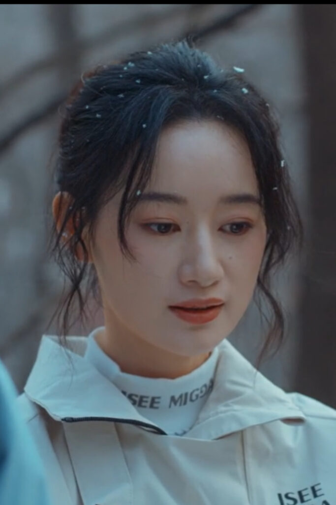 Scene from modern Chinese drama The Early Spring Episode 11 recap and review of a woman in snowboarding clothes in the snow