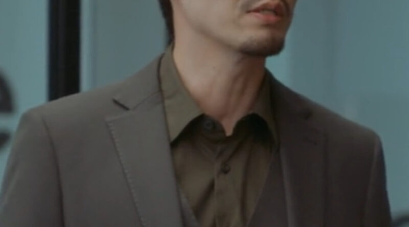 Scene from modern Chinese drama The Early Spring Episode 15 recap and review of a man with glasses in a brown suit