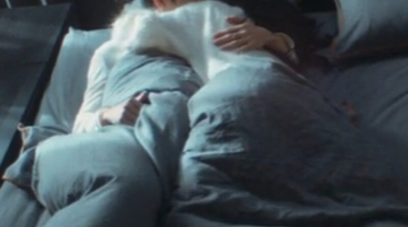 Scene from modern Chinese drama The Early Spring Episode 17 recap and review of a woman hugging her boyfriend tightly in bed