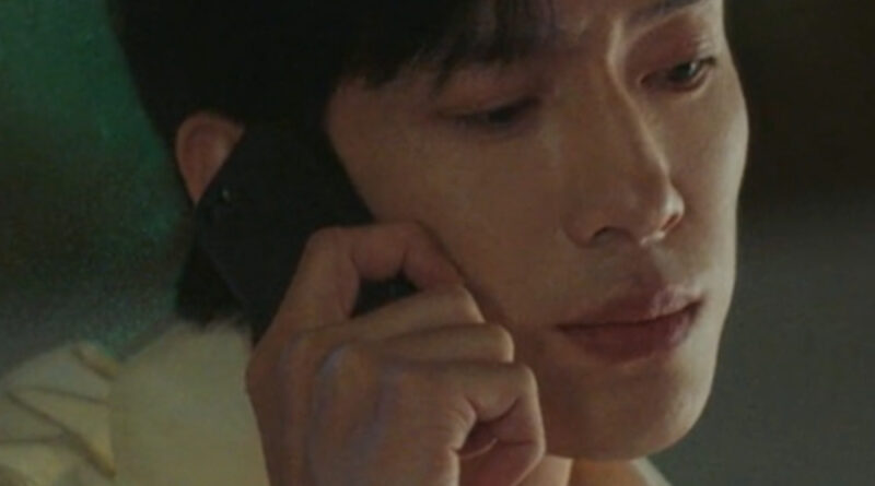 Scene from modern Chinese drama The Early Spring Episode 9 recap and review of a man on his phone