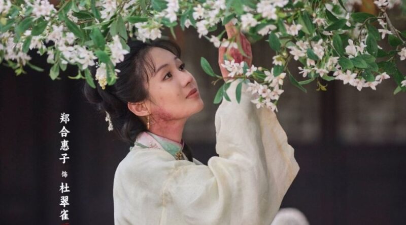 Scene from period Chinese drama Against The Current (2026) Episode 18 Recap and review of a woman with a rash on her neck and face plucking flowers from a tree