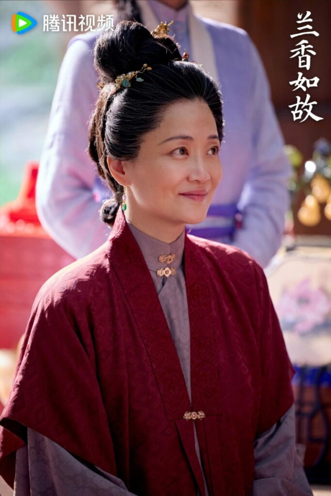 Scene from period Chinese drama Against The Current (2026) Episode 41 Recap and review of a grandmother in maroon and purple hanfu, smiling
