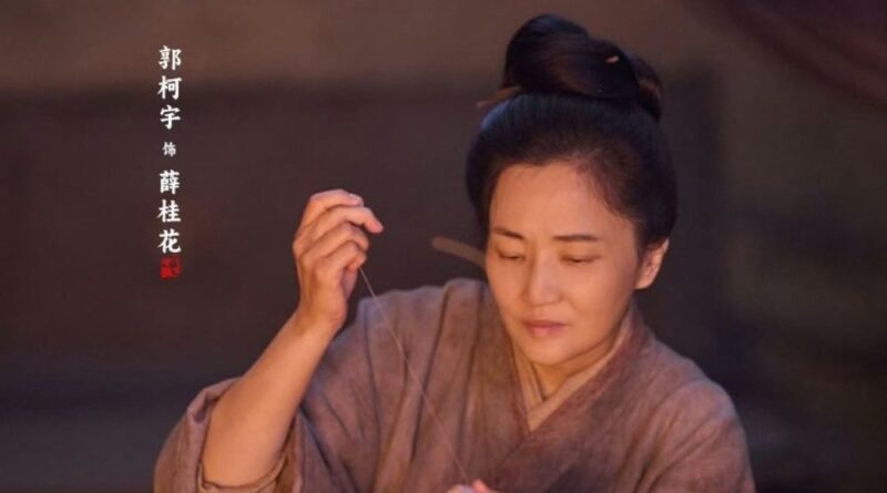 Scene from period Chinese drama Against The Current (2026) Episode 6 Recap and review of a woman sewing clothes at night