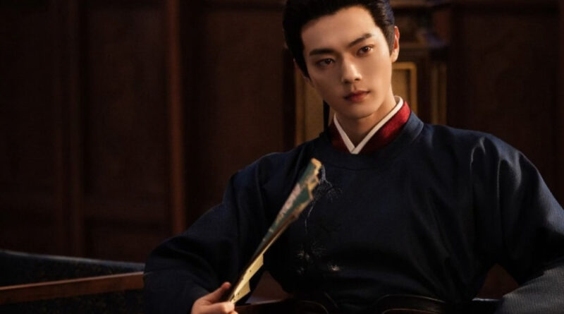 Scene from period Chinese drama Spring of The Blade (2026) Episode 13 Recap and review of a man in blue hanfu sitting and using a fan to fan himself