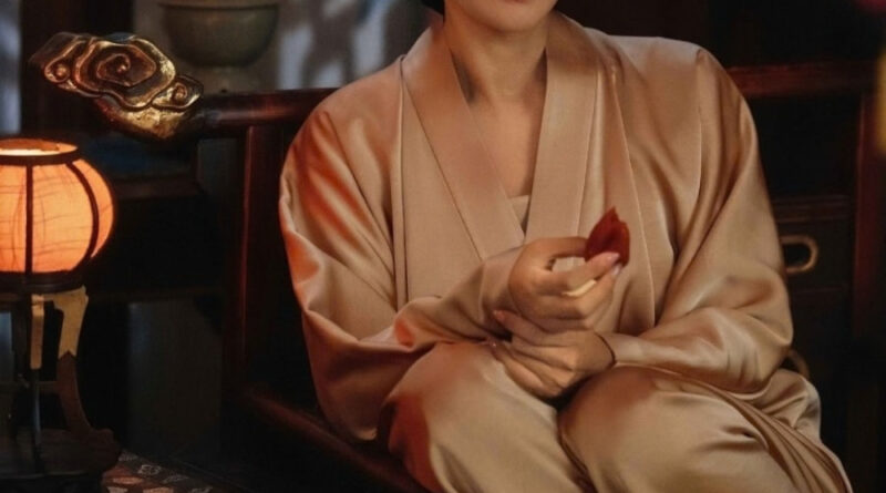 Scene from period Chinese drama Spring of The Blade (2026) Episode 20 Recap and review of a woman in night robes eating dried persimmon