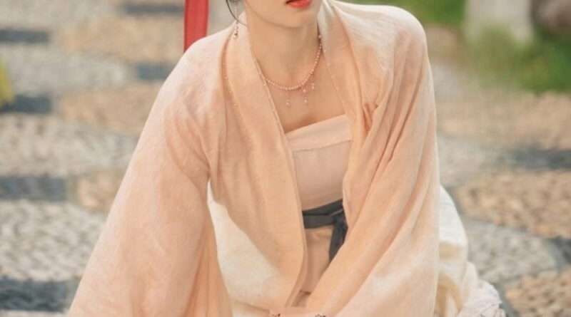 Scene from period Chinese drama Spring of The Blade (2026) Episode 3 Recap and review of a woman sitting on a pebbled floor outside