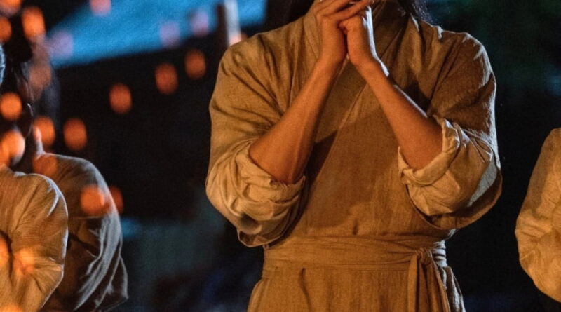 Scene from period Chinese drama Spring of The Blade (2026) Episode 30 Recap and review of a man in plain clothes in front of a bonfire and hands are together in thanks